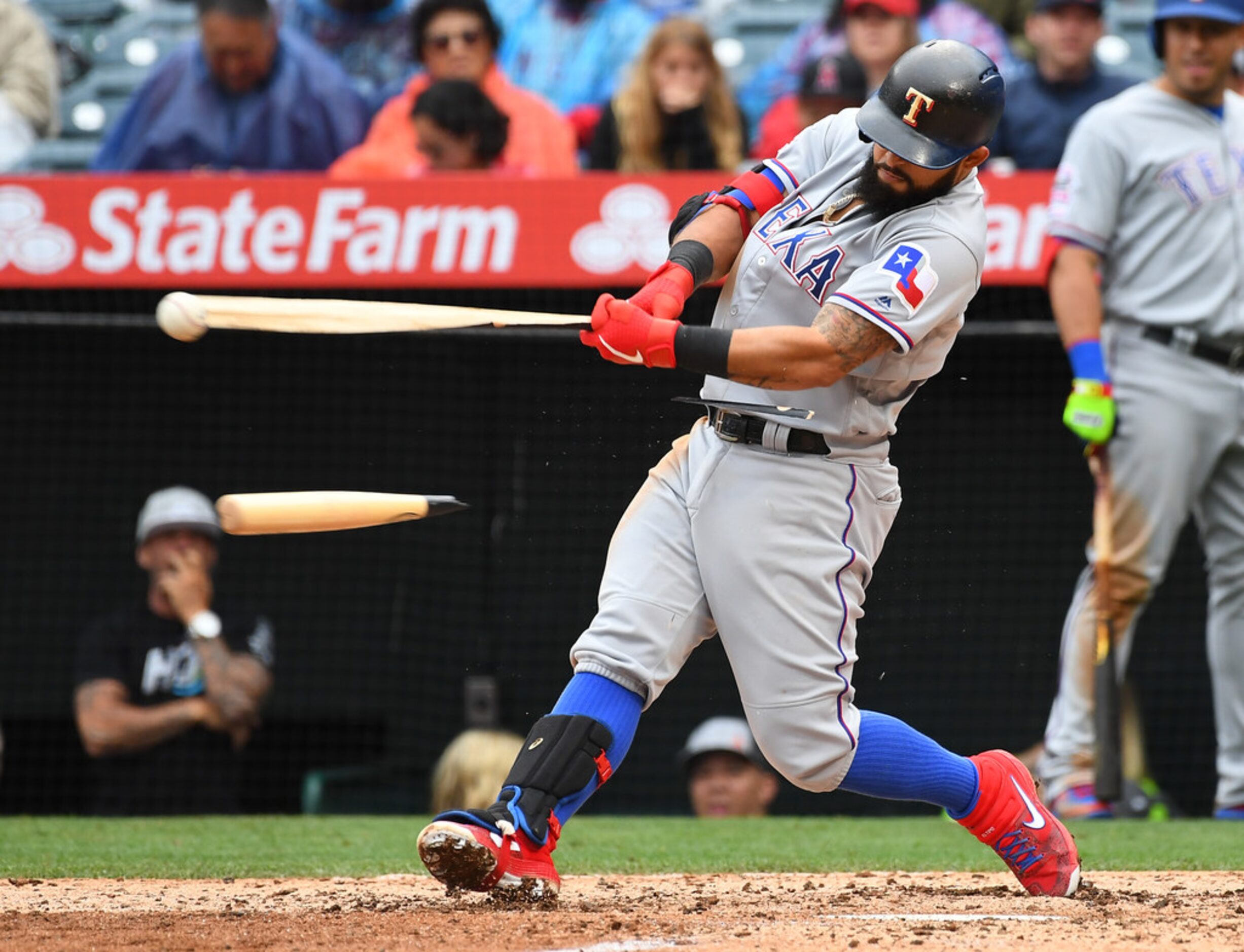 ANAHEIM, CA - MAY 26: Rougned Odor #12 of the Texas Rangers breaks his bat on a RBI single...