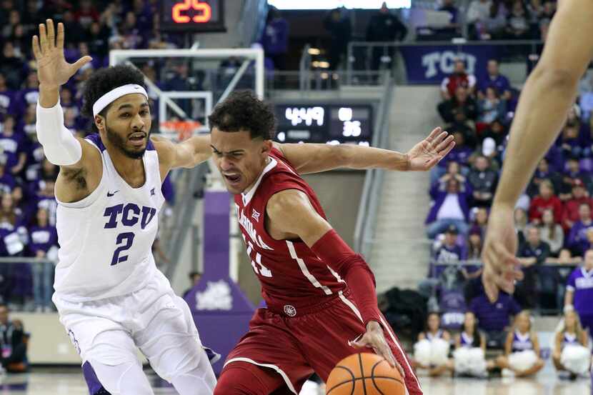 TCU guard Shawn Olden (2) defends as Oklahoma guard Trae Young (11) drives past during an...