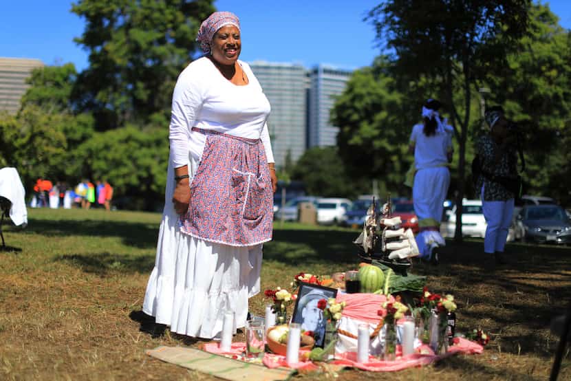 Wanda Blake with an altar of symbolic foods during a Juneteenth Ritual of Remembrance in...