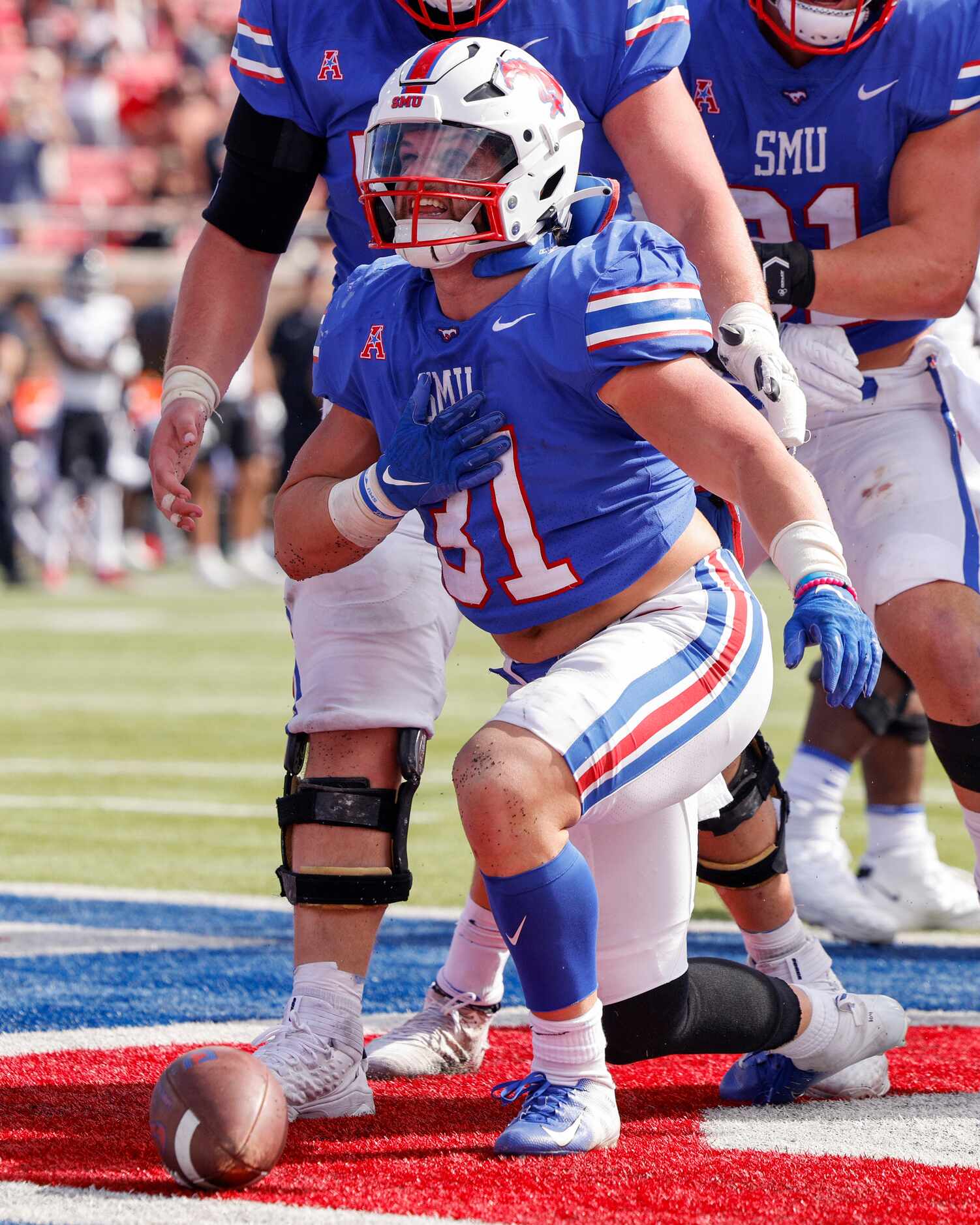 SMU running back Tyler Lavine (31) celebrates a touchdown during the second half of an NCAA...