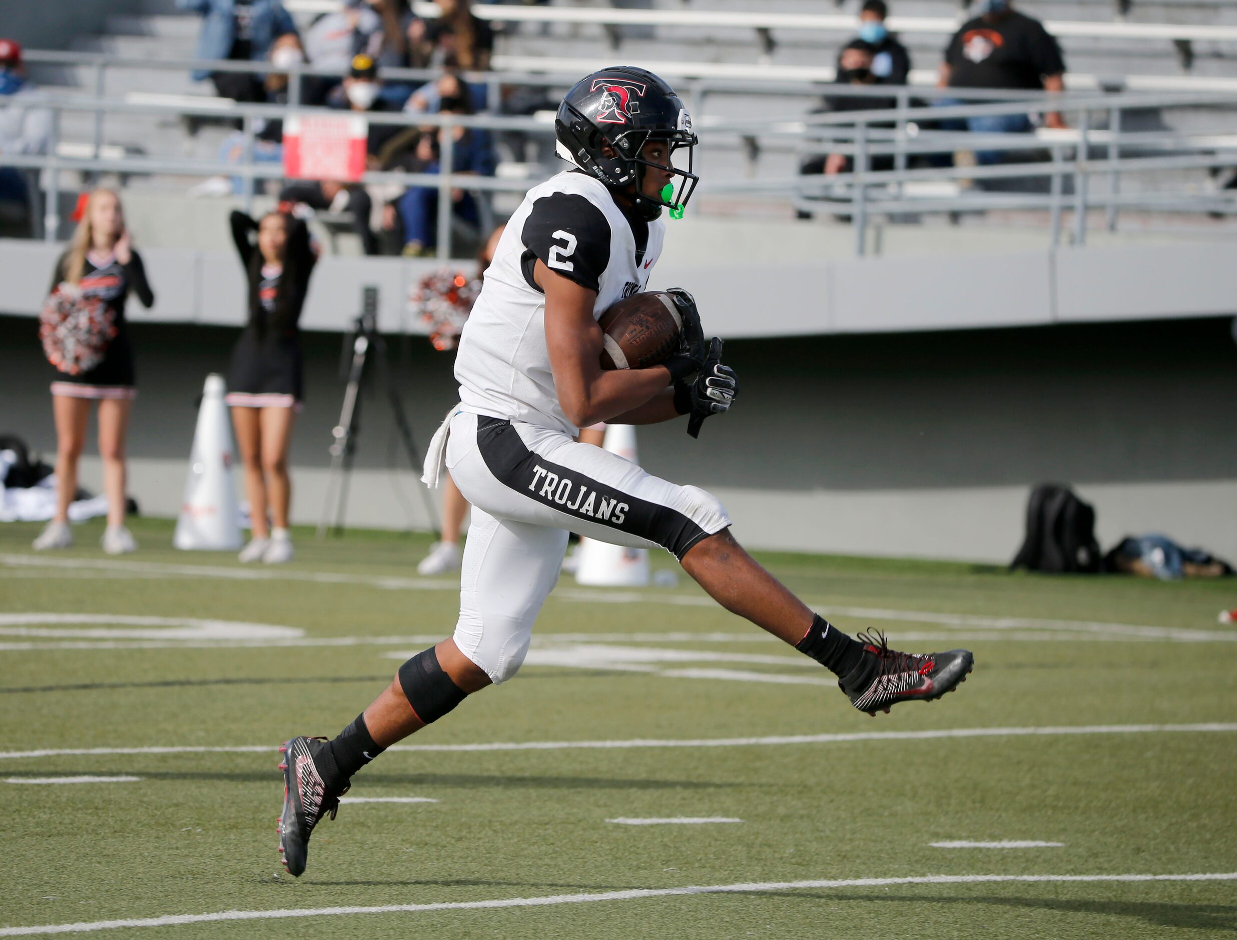 Euless Trinity running back Ollie Jordon (2) scores a touchdown against Haltom during their...