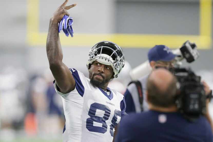Dallas Cowboys wide receiver Dez Bryant (88) waves to fans before the start of an NFL...
