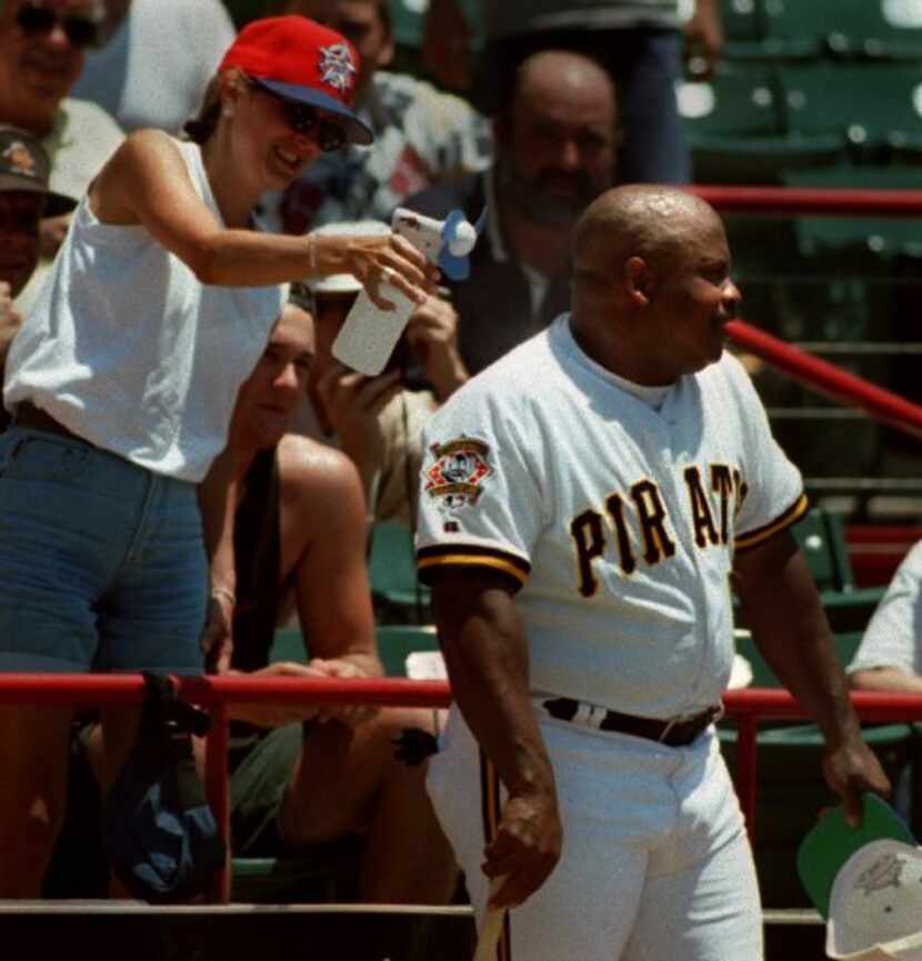 Kris Wilson of Garland sprays  former Texas Ranger (and Pittsburgh Pirate) Bill Madlock with...