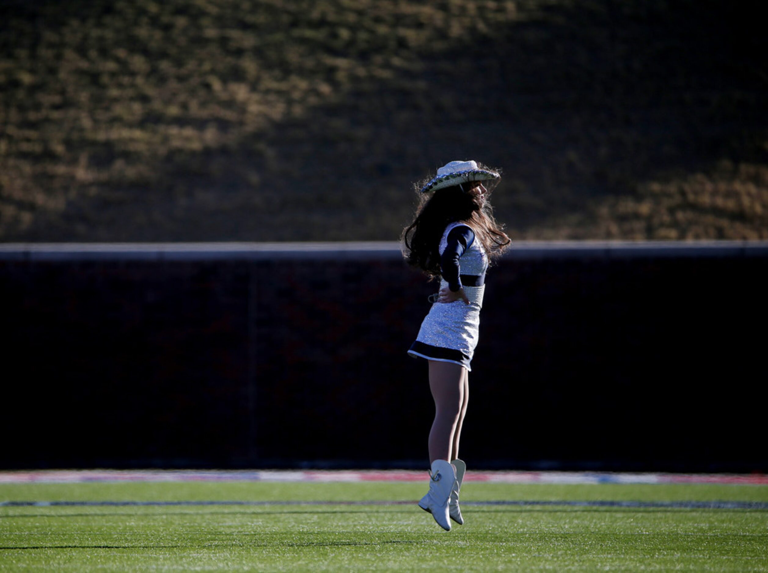 A Frisco Lone Star Rangerettes member performs during halftime of the Class 5A Division II...