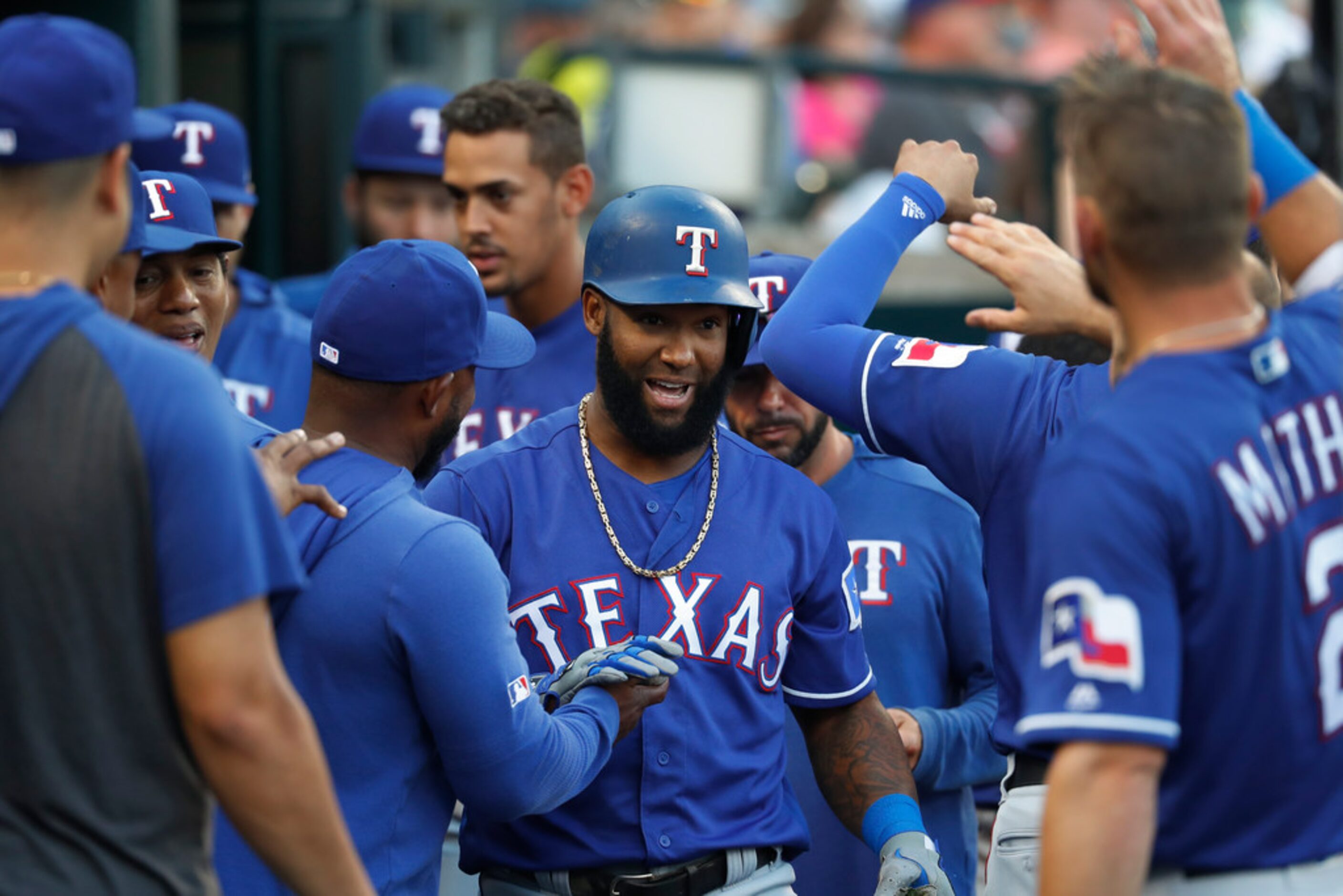 Texas Rangers' Danny Santana celebrates his solo home run in the fifth inning of a baseball...