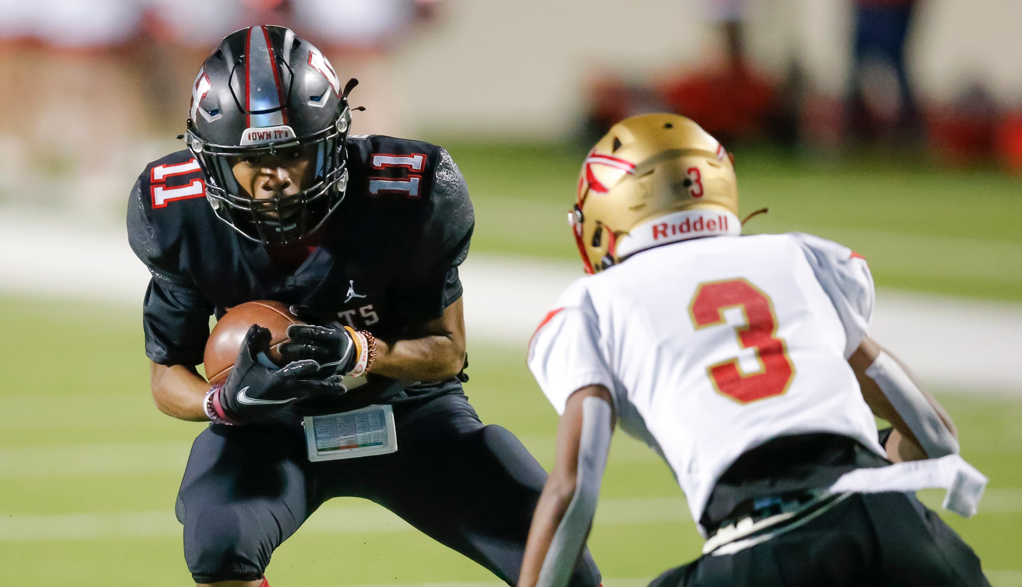 Lake Highlands junior wide receiver Shamar Donaldson (11) looks for room against South Grand...