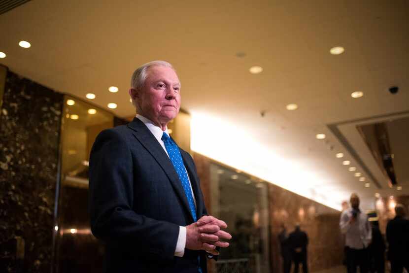 Sen. Jeff Sessions, R-Ala., speaks to reporters in the Trump Tower lobby, on Fifth Avenue in...