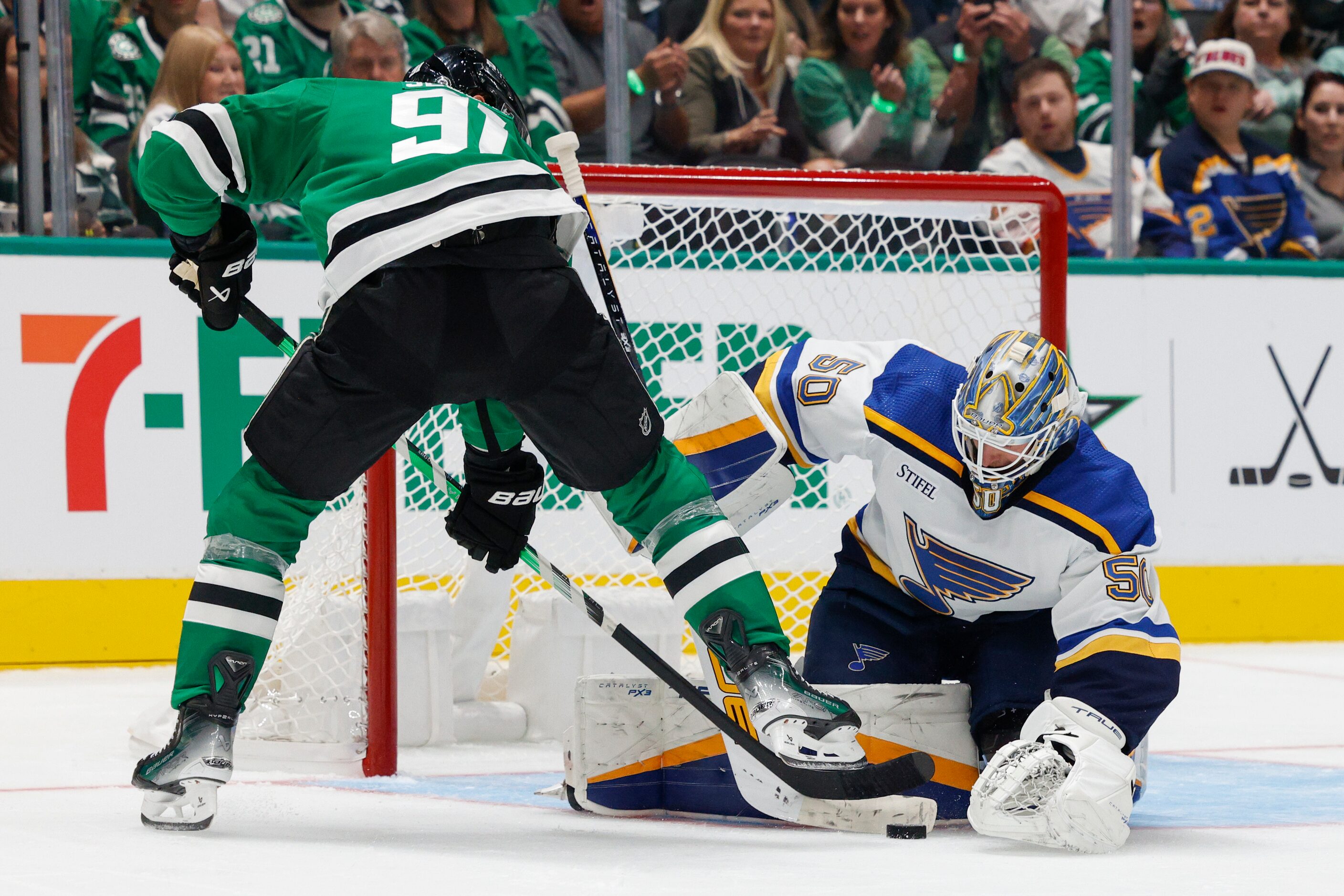 St. Louis Blues goaltender Jordan Binnington (50) stops a shot from Dallas Stars center...