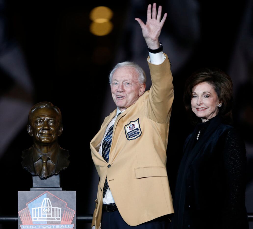Dallas Cowboys owner and general manager Jerry Jones waves to the crowd with his wife Gene...