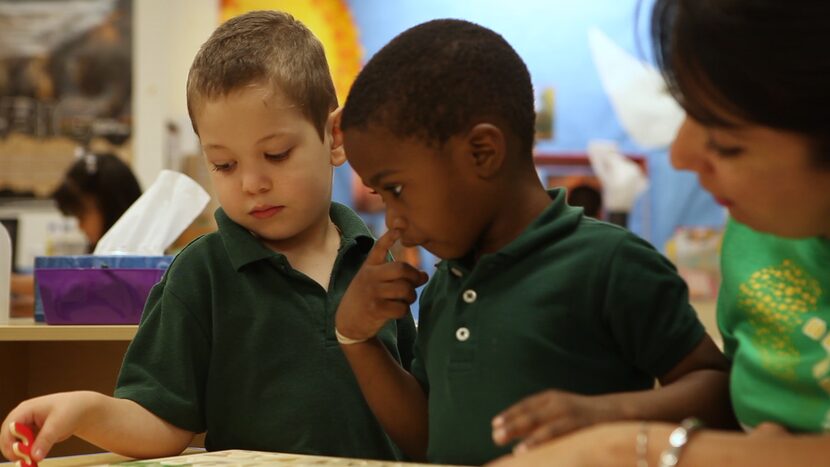 A teacher works with students at Harllee Early Childhood Center on Tuesday March 28, 2017.