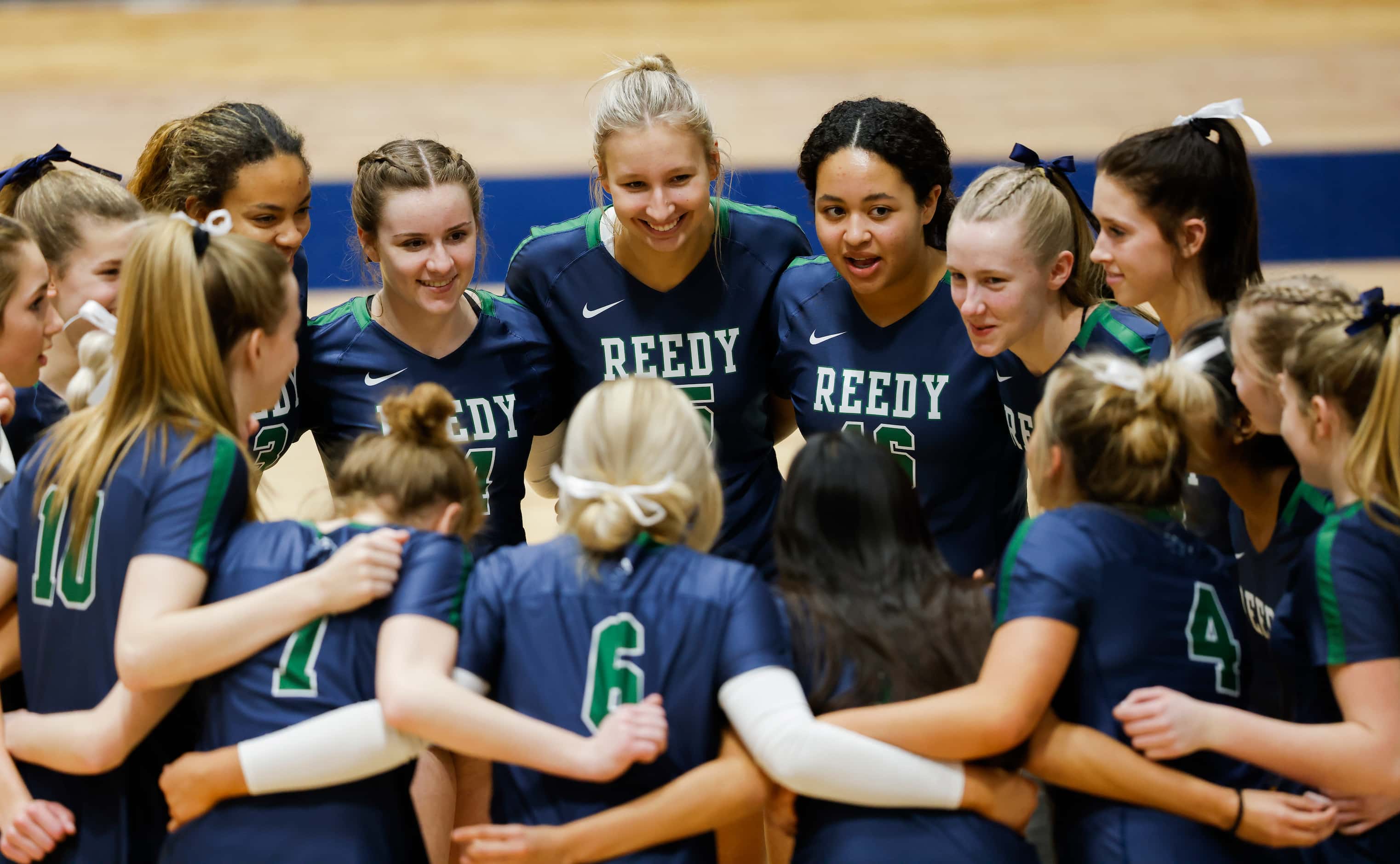 Frisco Reedy Lions huddle before the start of a Class 5A Region II final volleyball game...