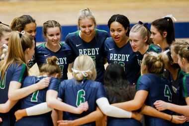 Frisco Reedy Lions huddle before the start of a Class 5A Region II final volleyball game...