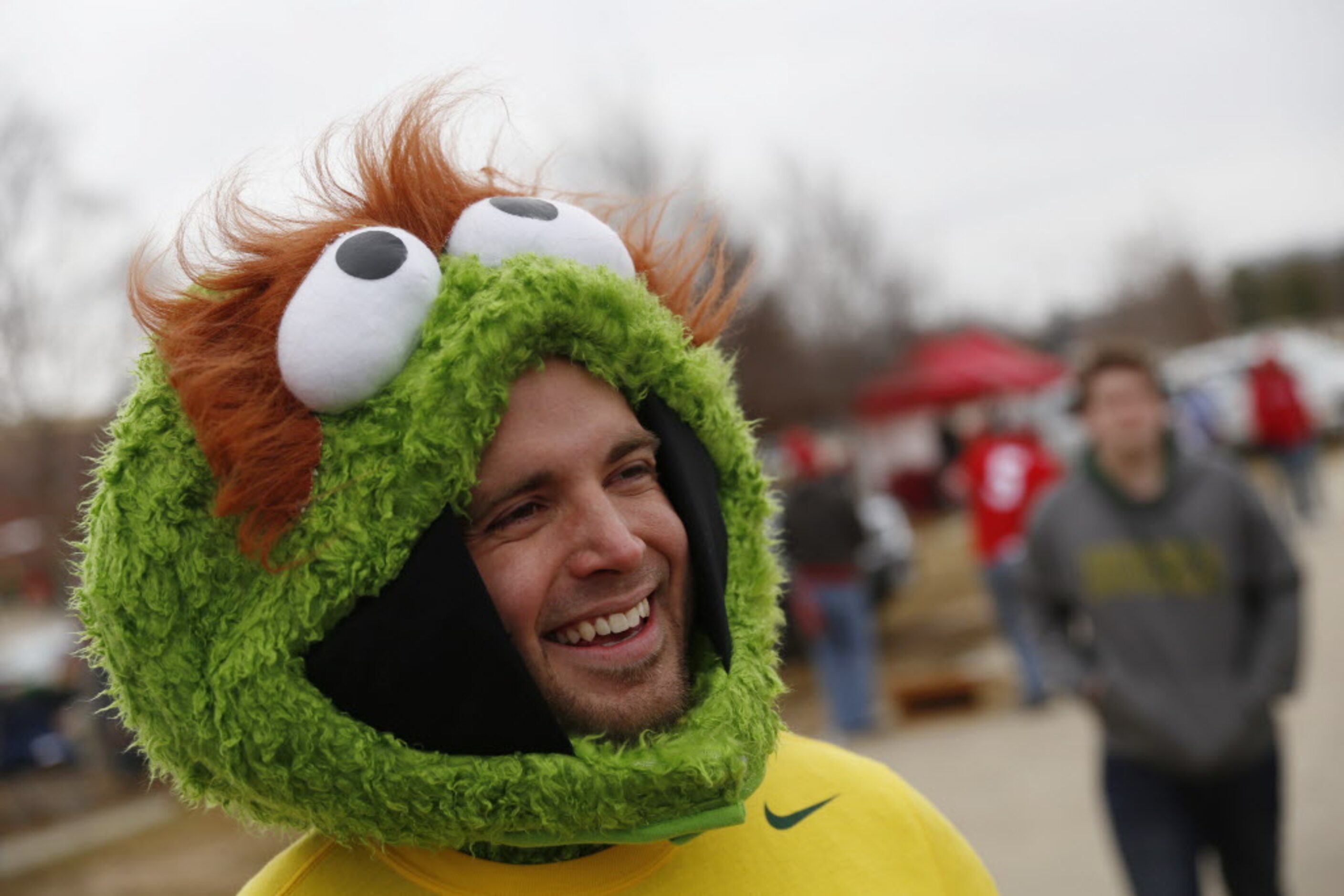 Oregon Ducks fan Jarrod Hale, of Portland, Oregon, speaks to his mother, Anne Graham, of...