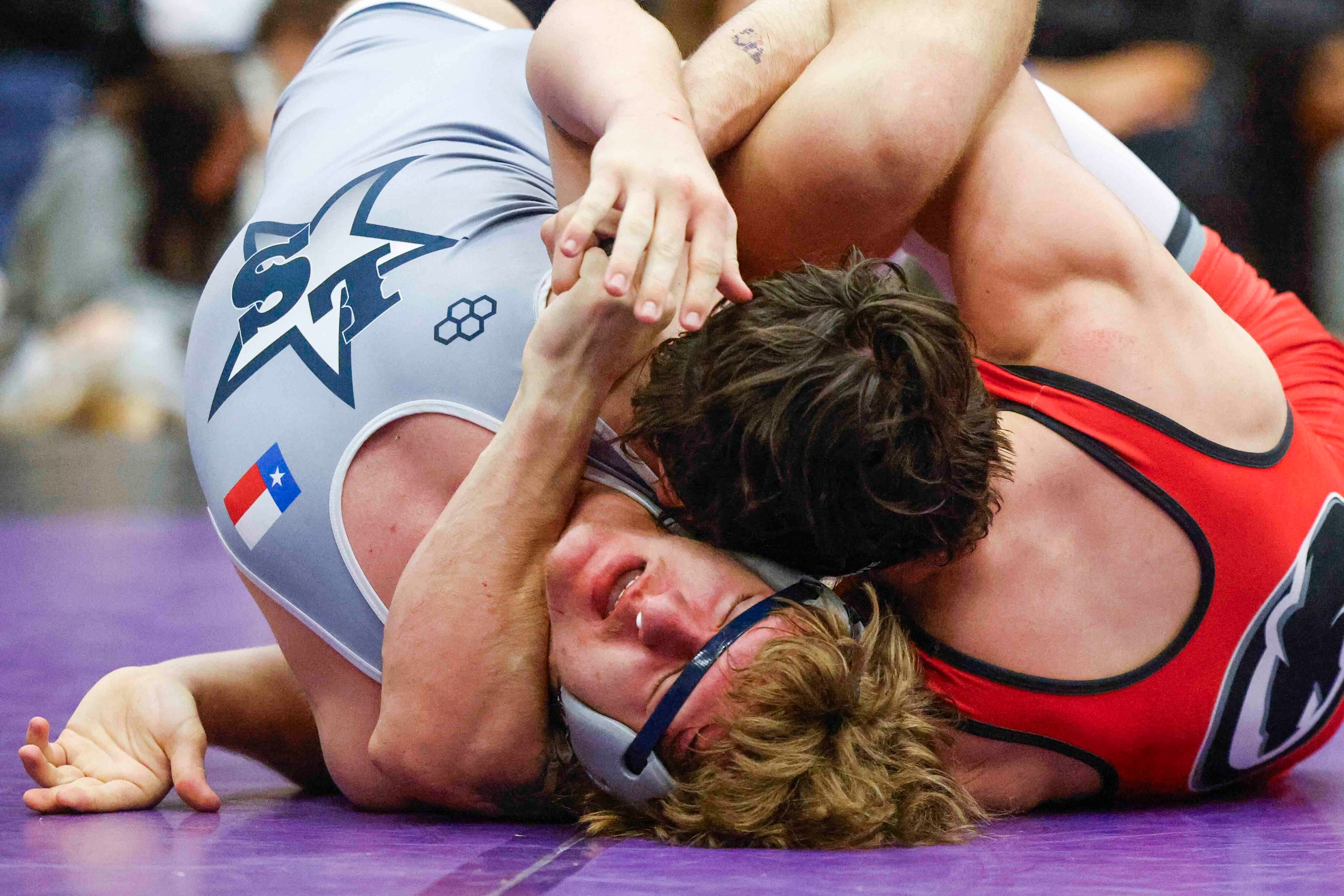 Erik Woolston of Lone Star wrestles with David Gormley of Dallas Hillcrest during 5A Region...