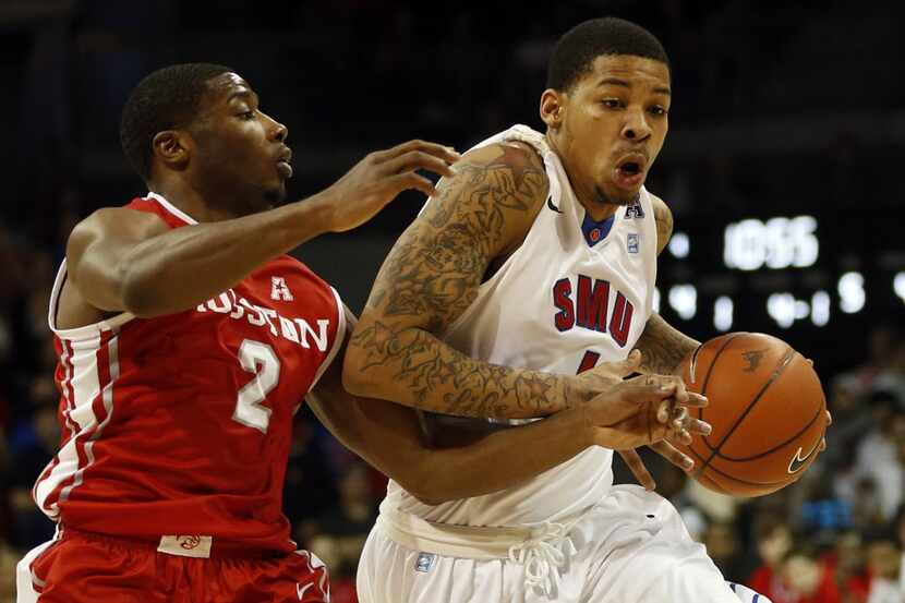Southern Methodist Mustangs guard Keith Frazier (4) drives past Houston Cougars guard...