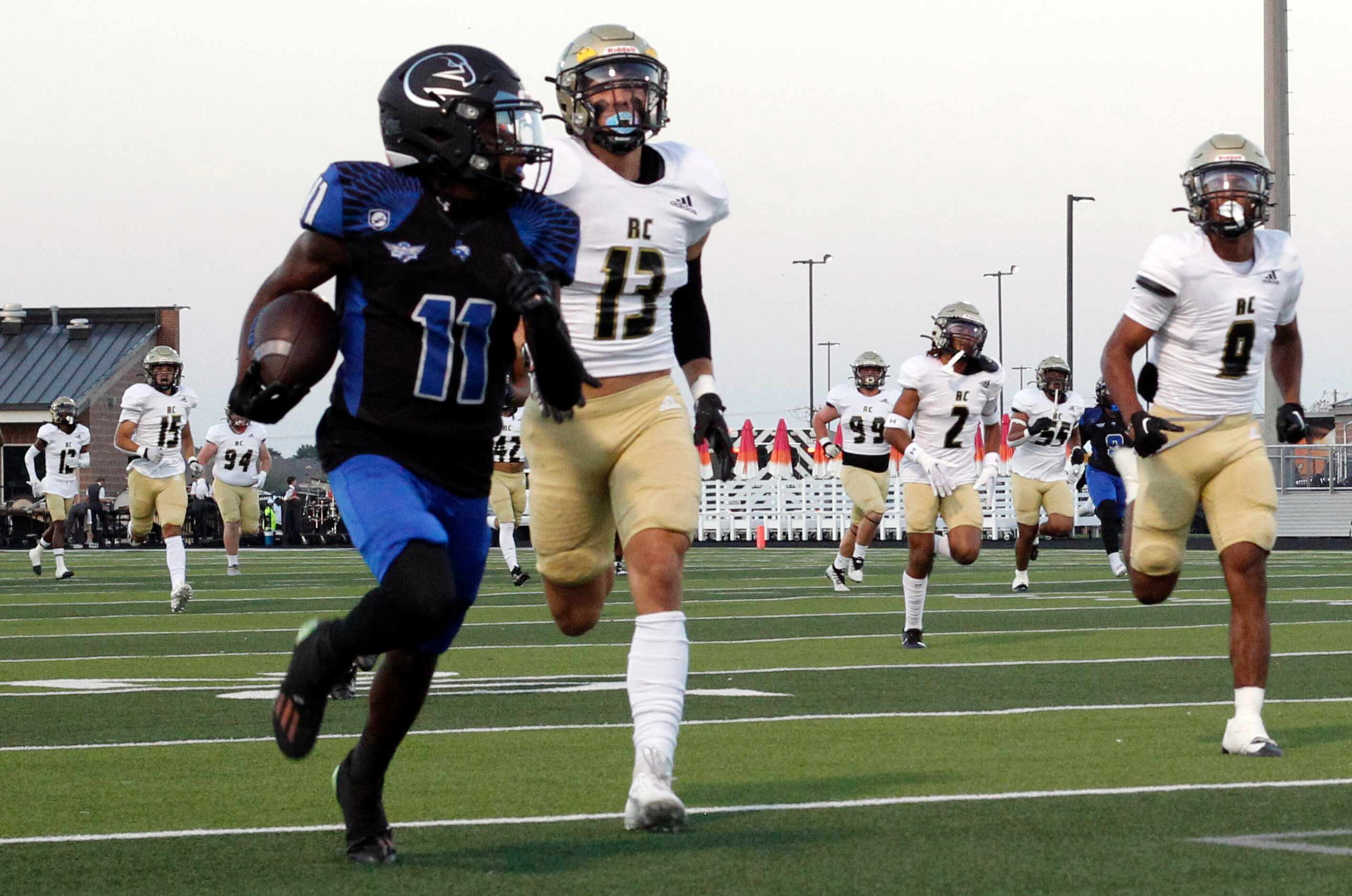North Forney receiver Jaquarion Robinson (11) attracts the attention of nine Royse City...