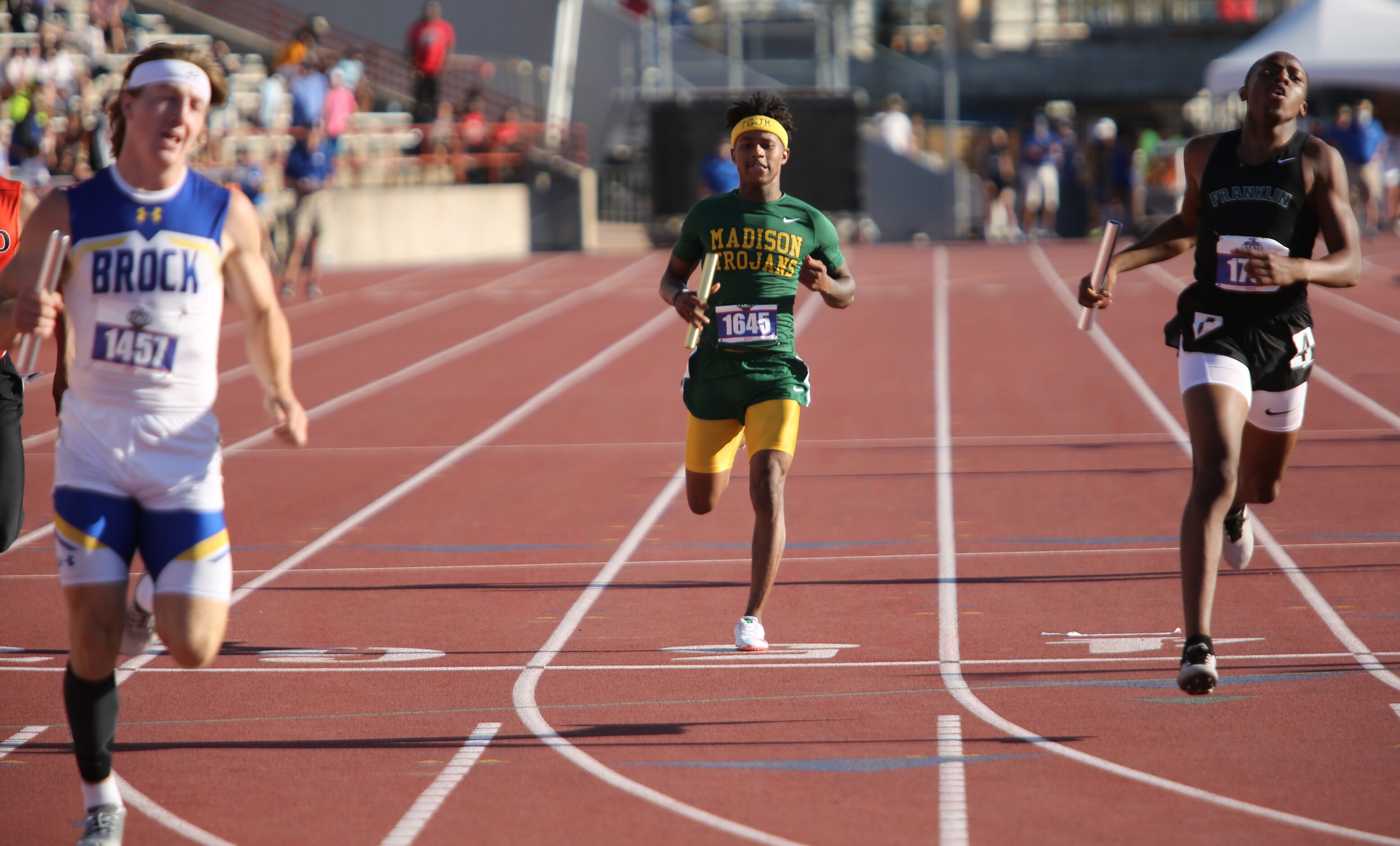 Dallas Madison's Savion Williams run towards the finish line during his 3A boys 4x200 relays...