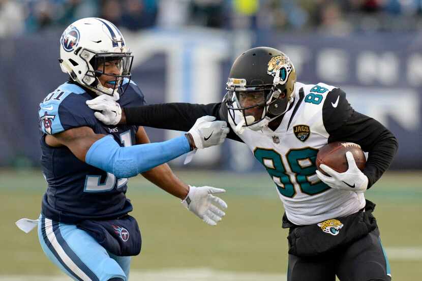 Jacksonville Jaguars wide receiver Allen Hurns (88) tries to get past Tennessee Titans free...