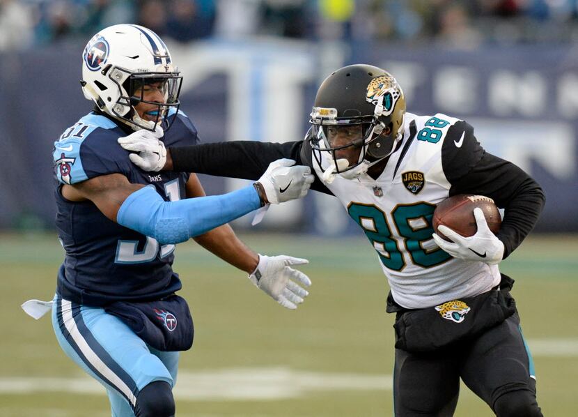 Jacksonville Jaguars wide receiver Allen Hurns (88) tries to get past Tennessee Titans free...