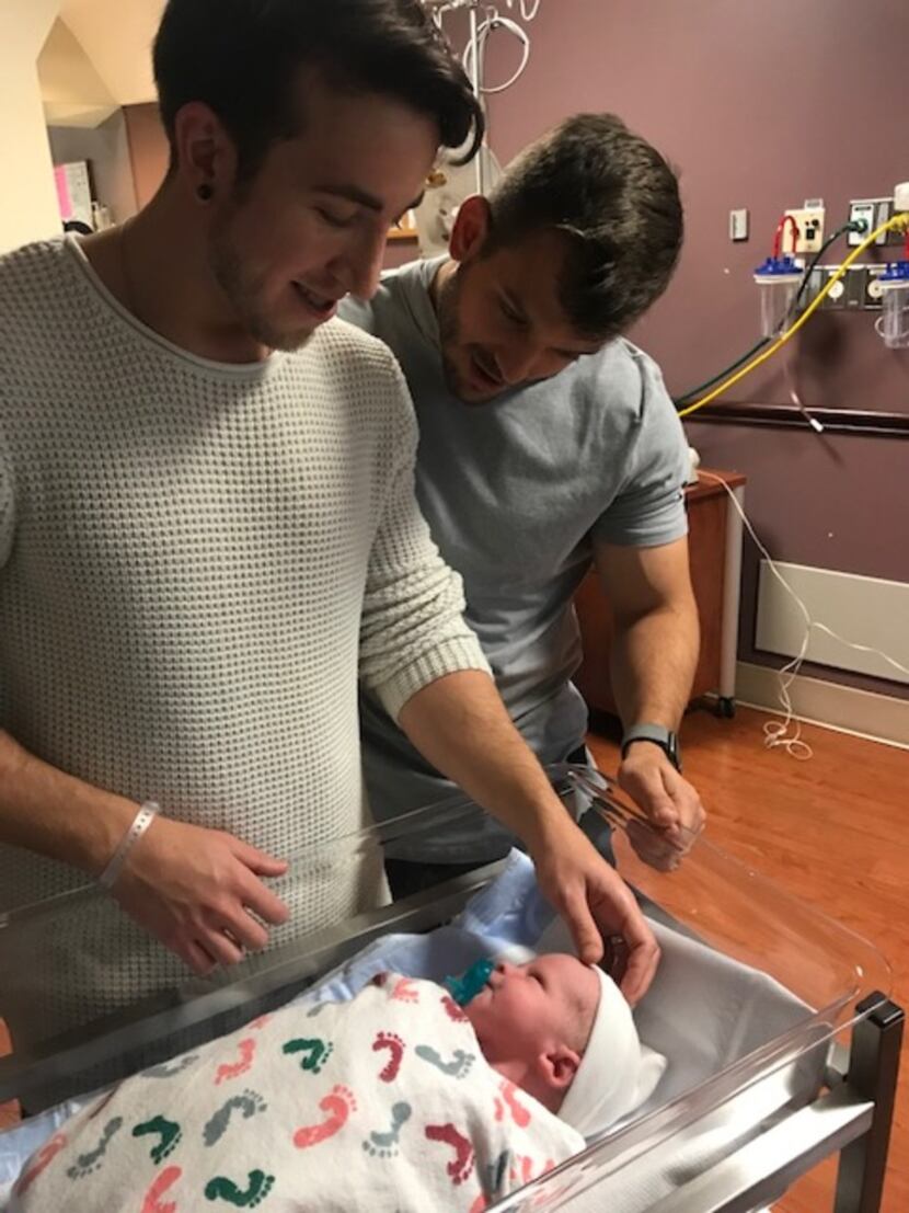 Dallas residents Alex Reyher (left) and Ryan Layman (right) welcome their newborn, Rory. The...