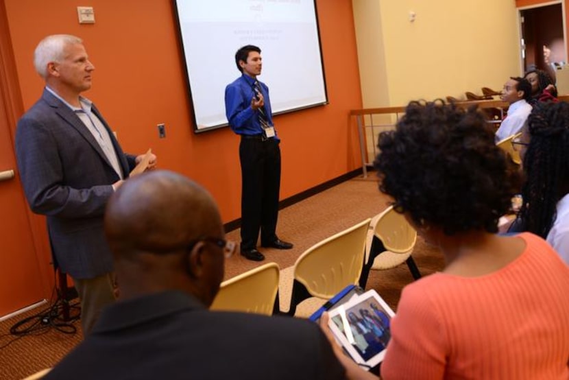 
Chris Hernandez, a senior at Cedar Hill Collegiate High School, talks during a Mayor's Teen...