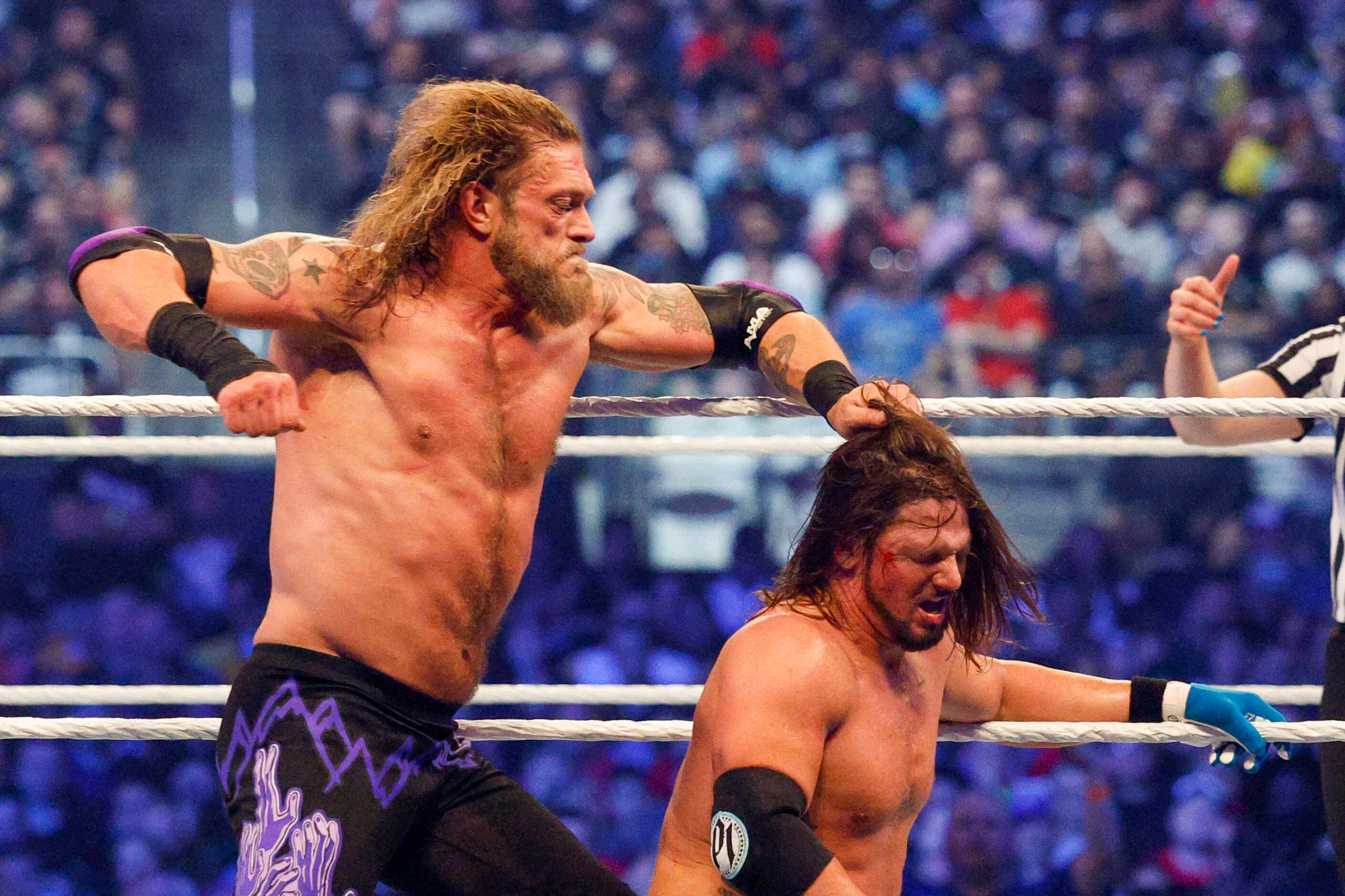Edge punches AJ Styles during a match at WrestleMania Sunday at AT&T Stadium in Arlington,...