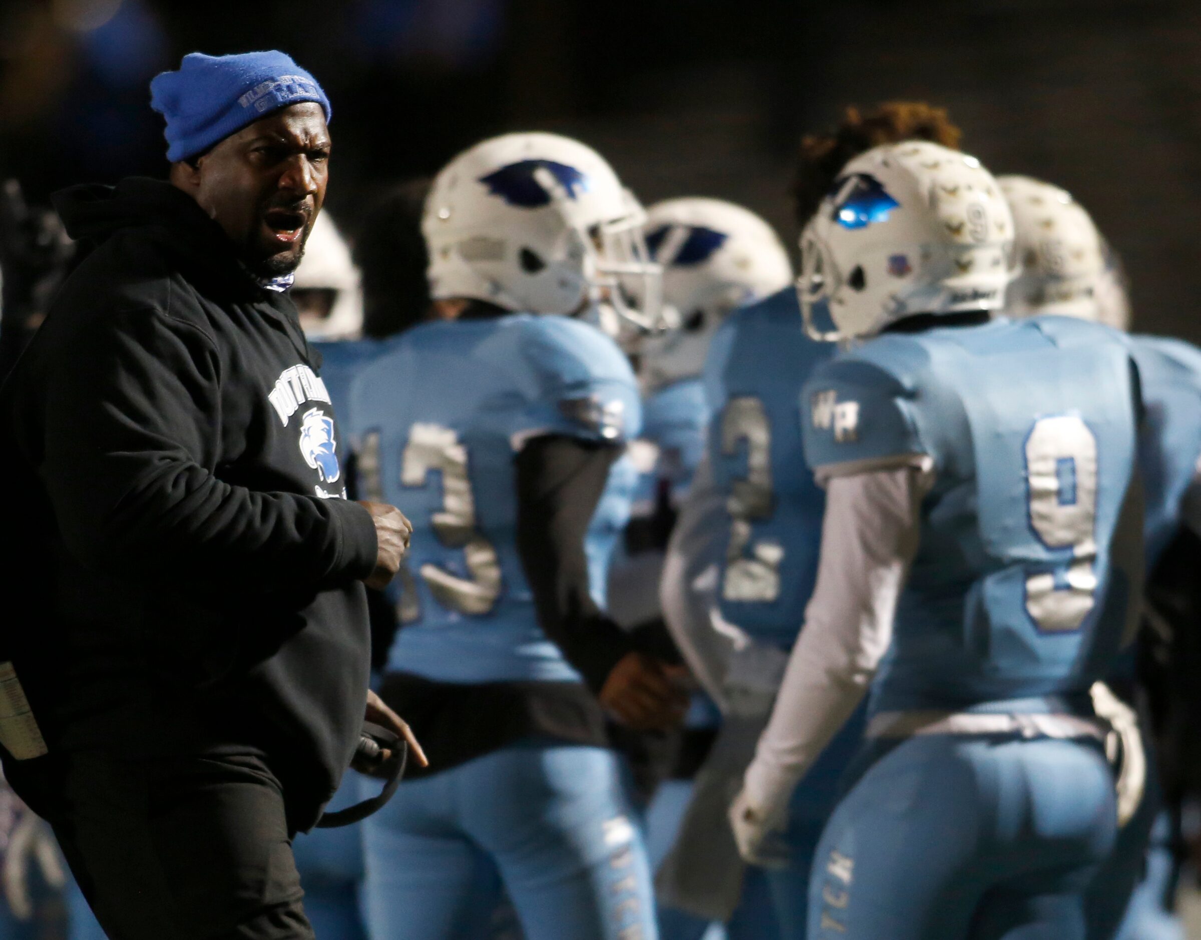 Wilmer Hutchins head coach Elzie Barnett Sr. shares some coaching feedback following an...