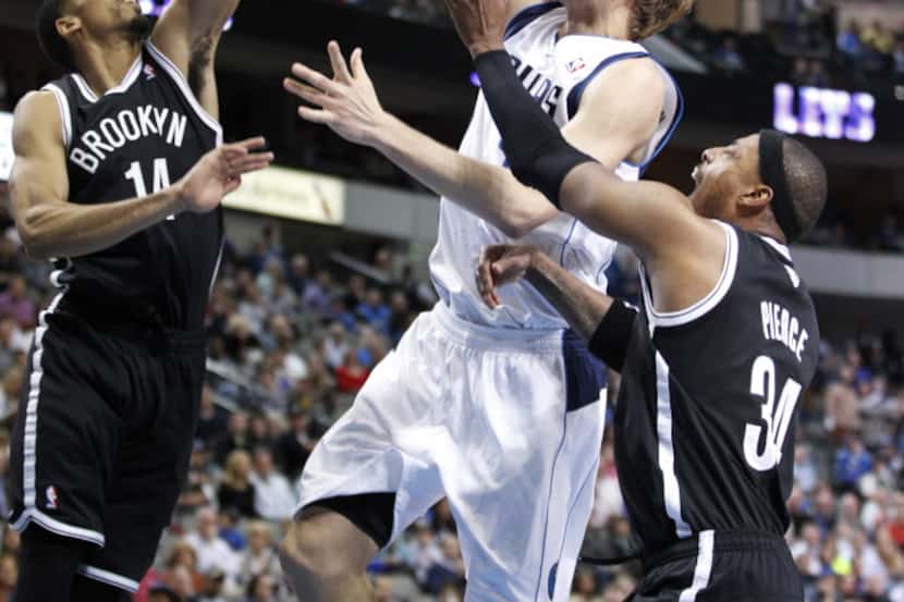 Dallas Mavericks forward Dirk Nowitzki (41) tries to score against Brooklyn Nets guard Shaun...