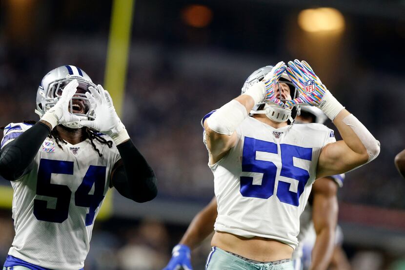 Dallas Cowboys middle linebacker Jaylon Smith (54) joins outside linebacker Leighton Vander...