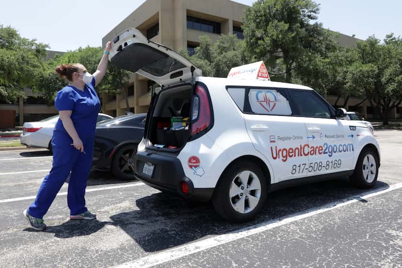 Charlee McHale prepares a mobile COVID testing vehicle at UrgentCare2Go in Farmers Branch,...