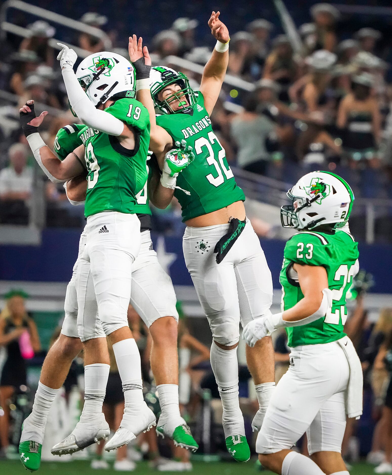 Southlake Carroll linebacker Benecio Porras (32) celebrates with defensive back Logan...