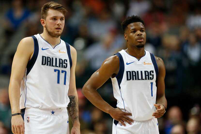 FILE - Mavericks guard/forward Luka Doncic (77) and guard Dennis Smith Jr. (1) are pictured...