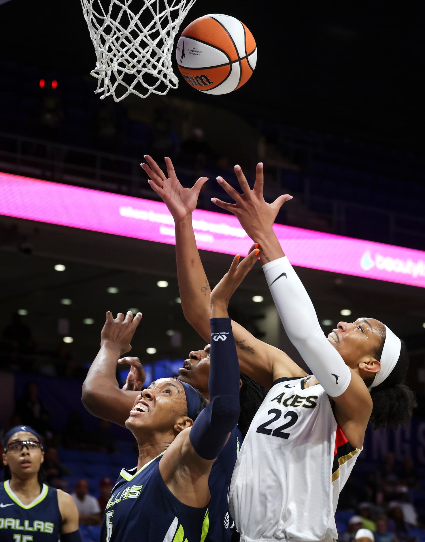 Dallas Wings center Teaira McCowan (7), Dallas Wings forward Kayla Thornton (6) and Las...