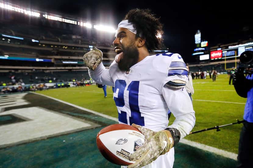 With the NBC game ball in hand, Dallas Cowboys running back Ezekiel Elliott (21) celebrates...