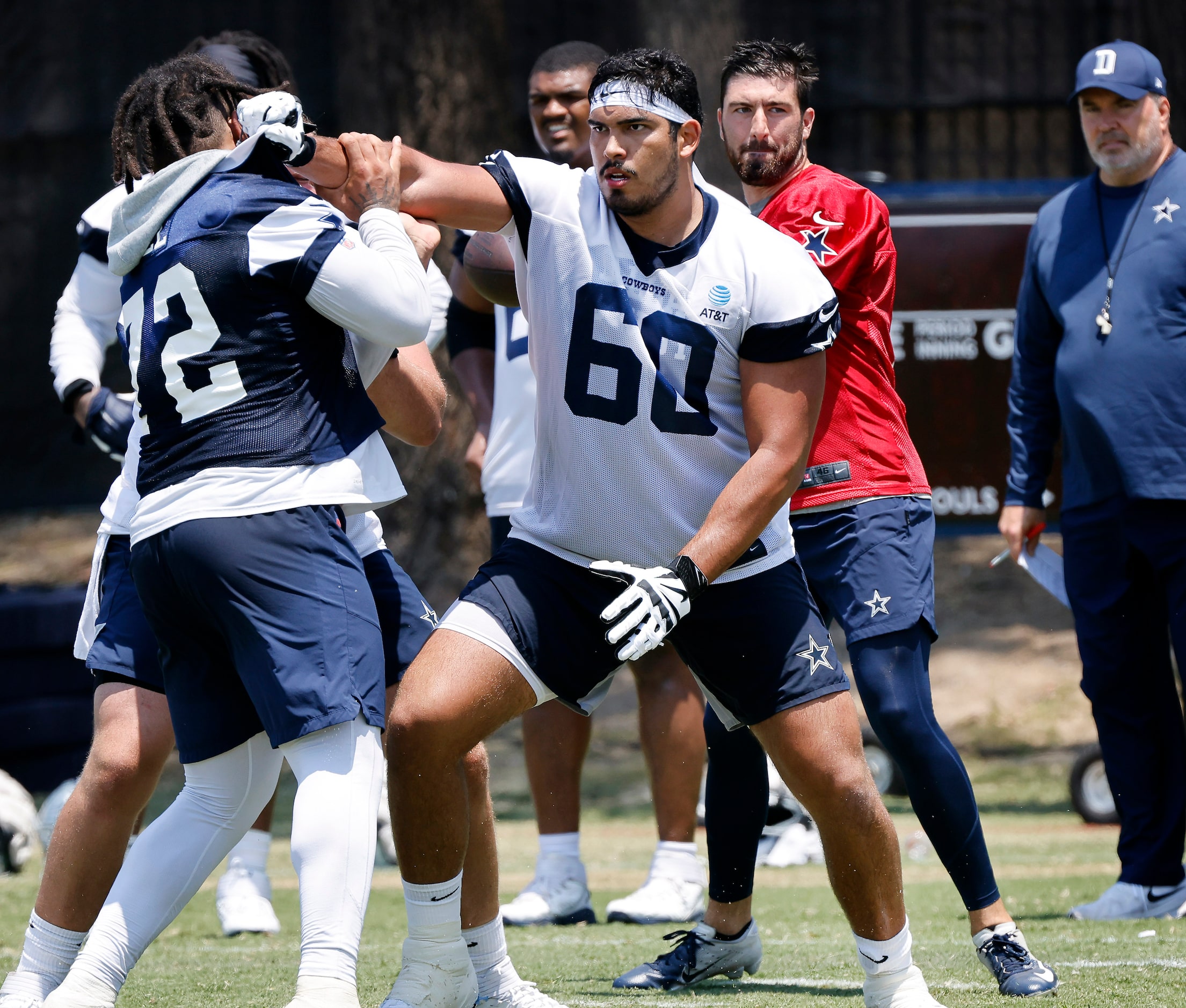 Dallas Cowboys offensive tackle Isaac Alarcon (60) gets a stiff arm on defensive tackle...