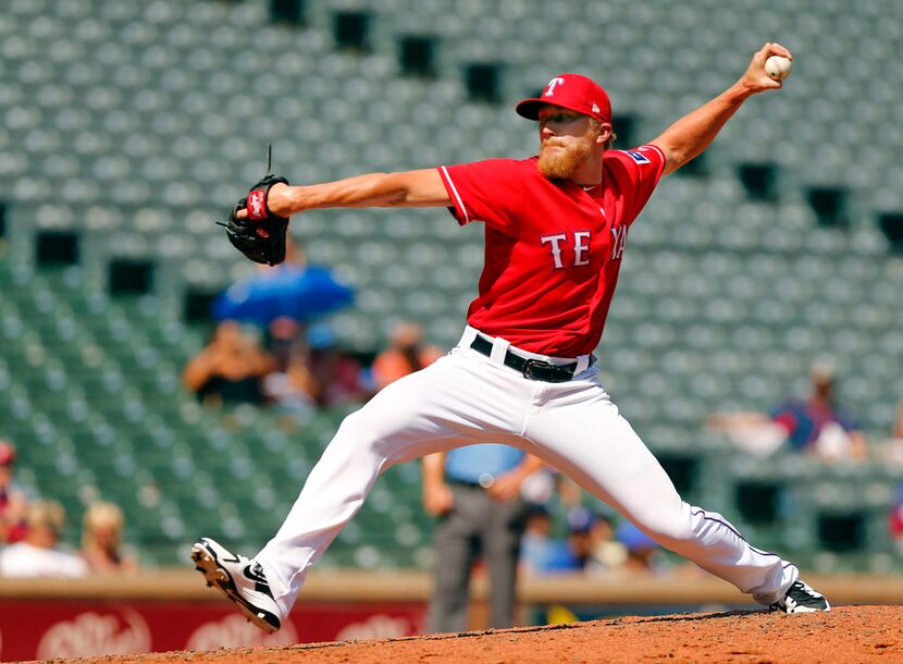 Texas Rangers relief pitcher Jake Diekman (41) throws in the eighth inning against the...