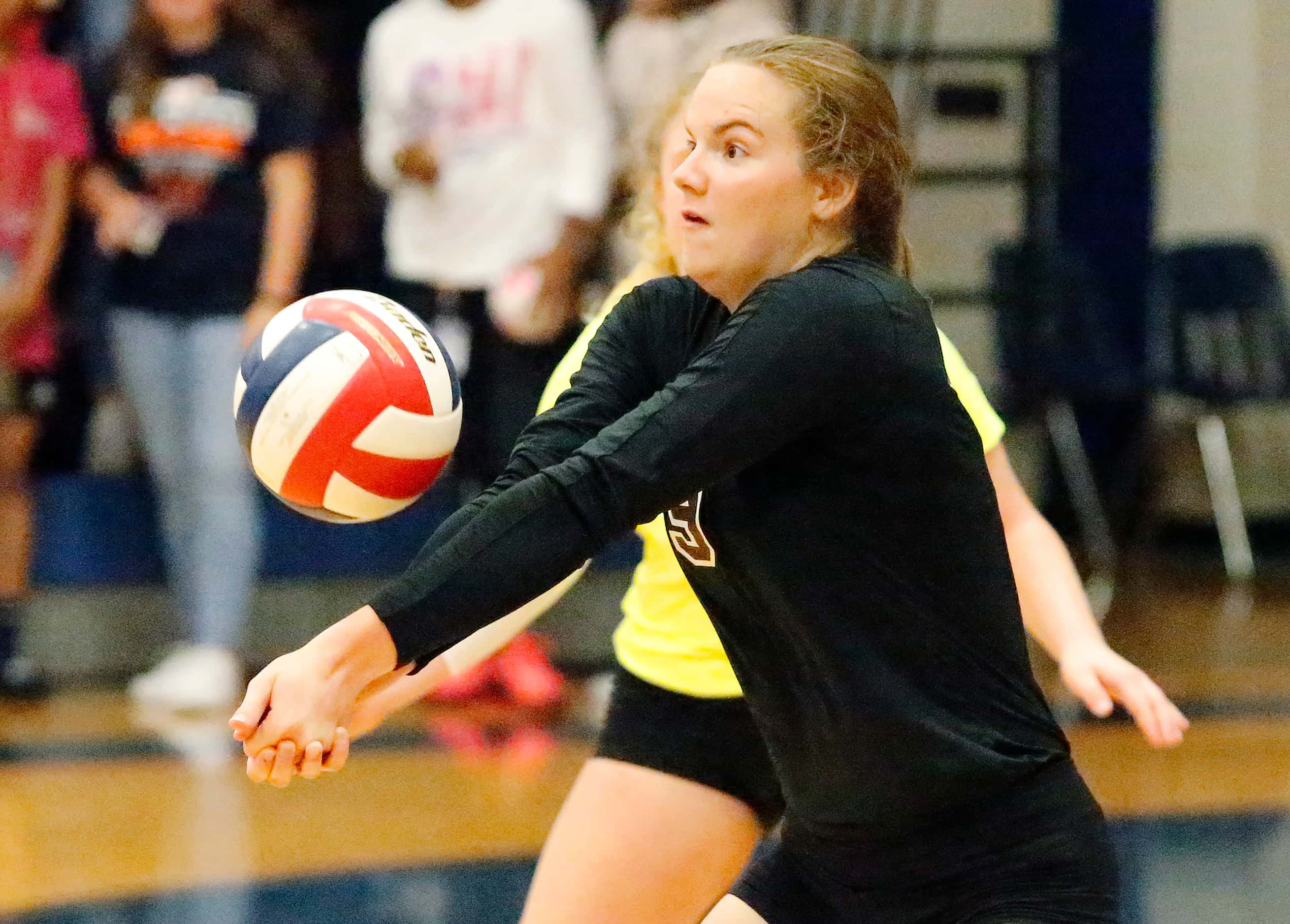 Wylie High School Ana Heath (9) fields a serve during game two as Sachse High School hosted...