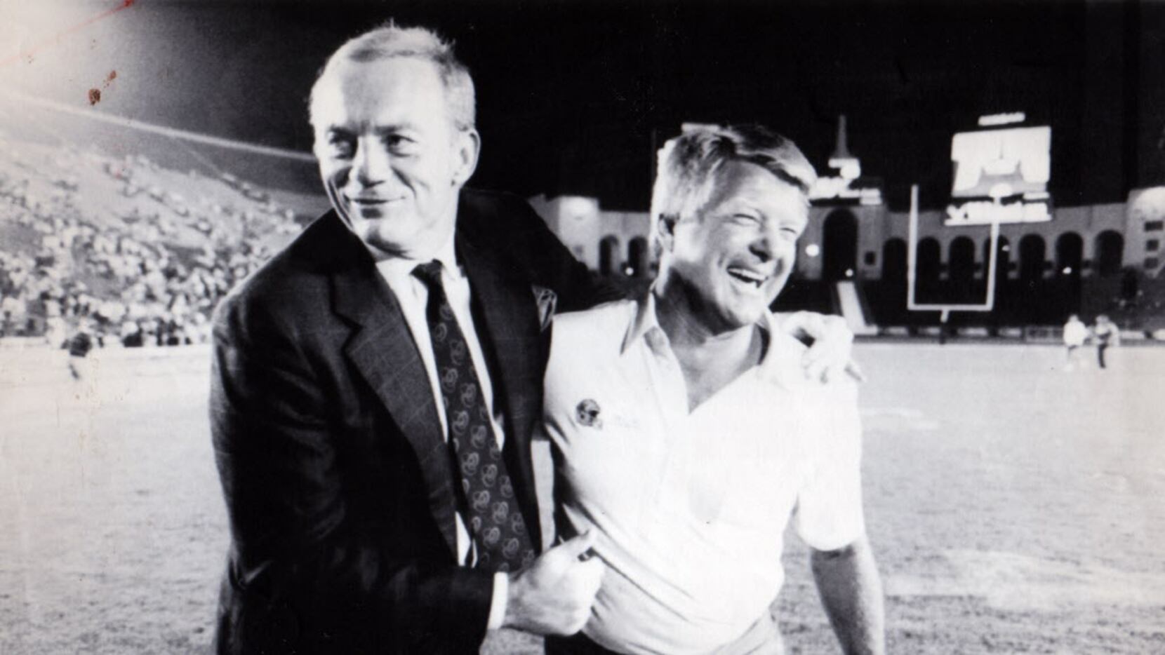 August 19, 1989 - Dallas Cowboys owner Jerry Jones and coach Jimmy Johnson walk off the...