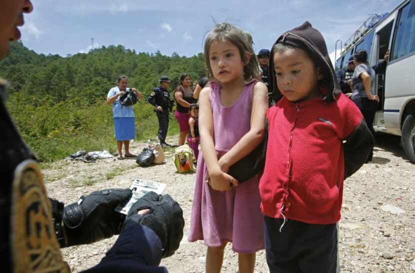 
Kids in Ocotepeque, Honduras, are questioned by an official wanting to know if they’re...