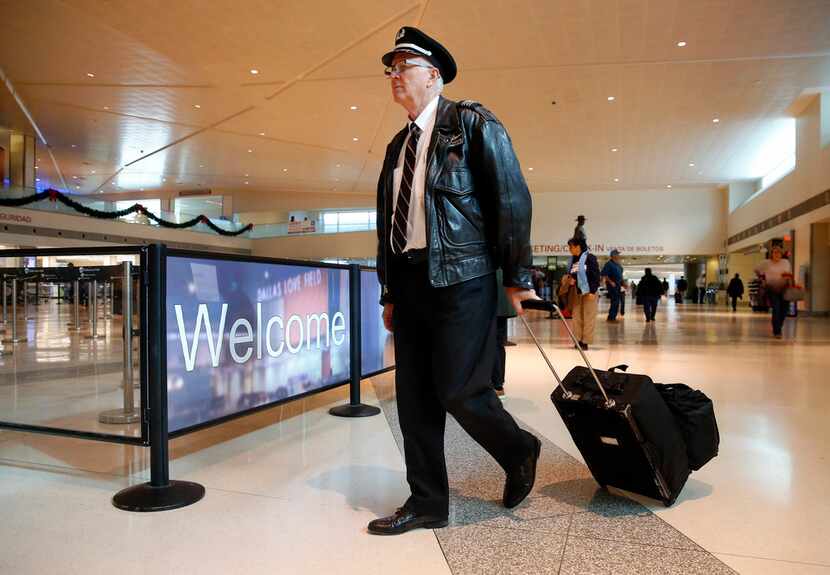 Southwest Airlines captain Kyle McDaniel arrives for work at Dallas Love Field, Wednesday,...