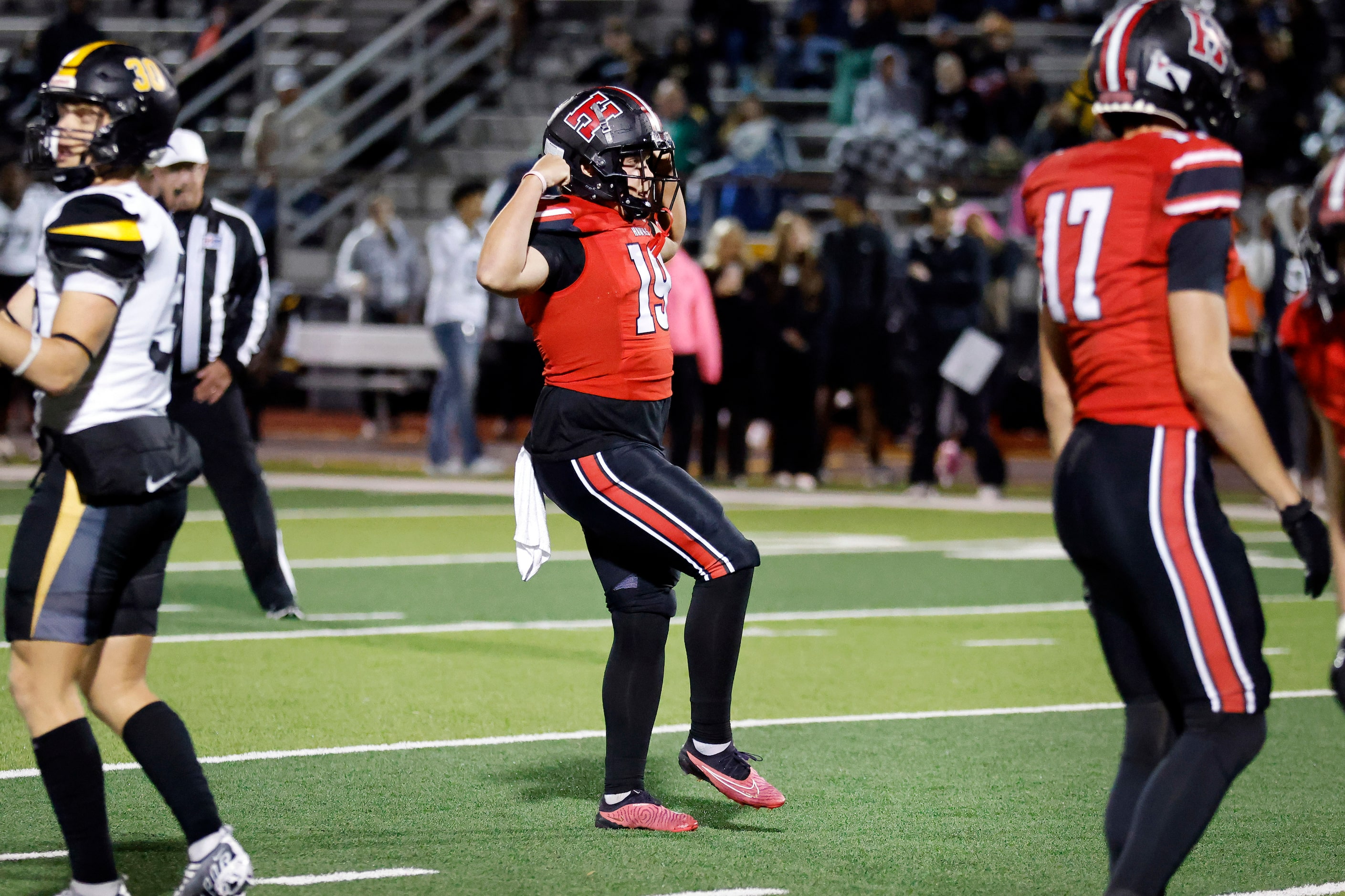 Rockwall-Heath kicker Bronson
Mueller (19) does a little dance after making a fort half...