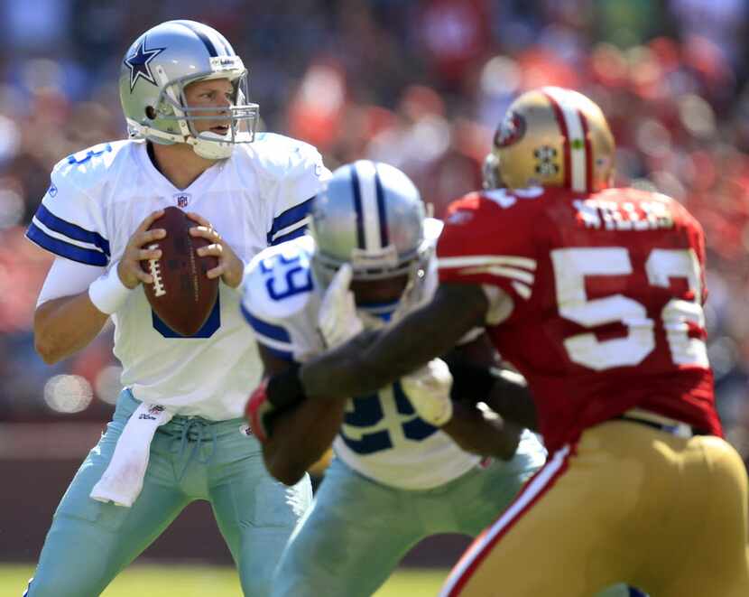 Dallas Cowboys quarterback Jon Kitna looks to throw against the San Francisco 49ers in the...