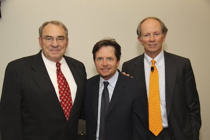 Dallas businessmen John Neill (left) and Shad Rowe (right) with actor Michael J. Fox at a...