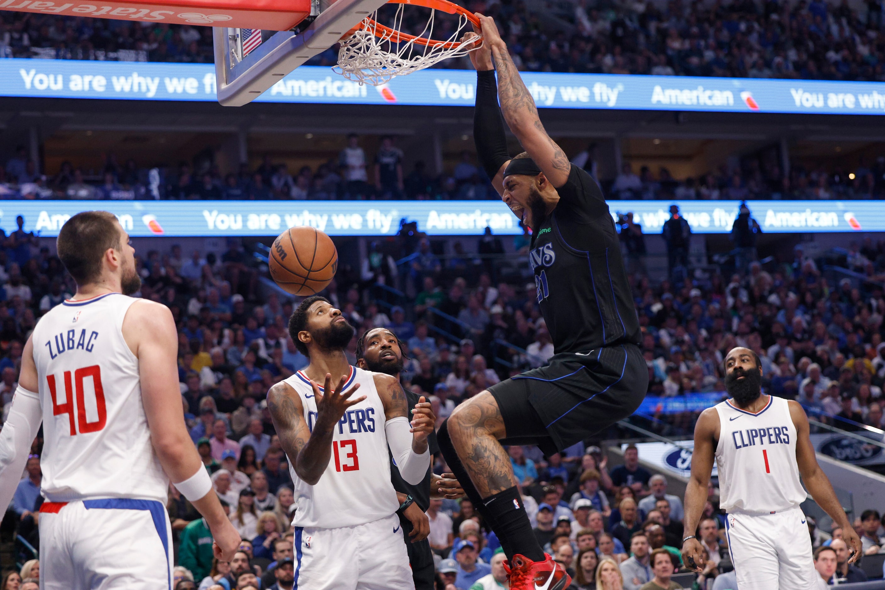 Dallas Mavericks center Daniel Gafford (21) dunks over LA Clippers forward Paul George (13)...