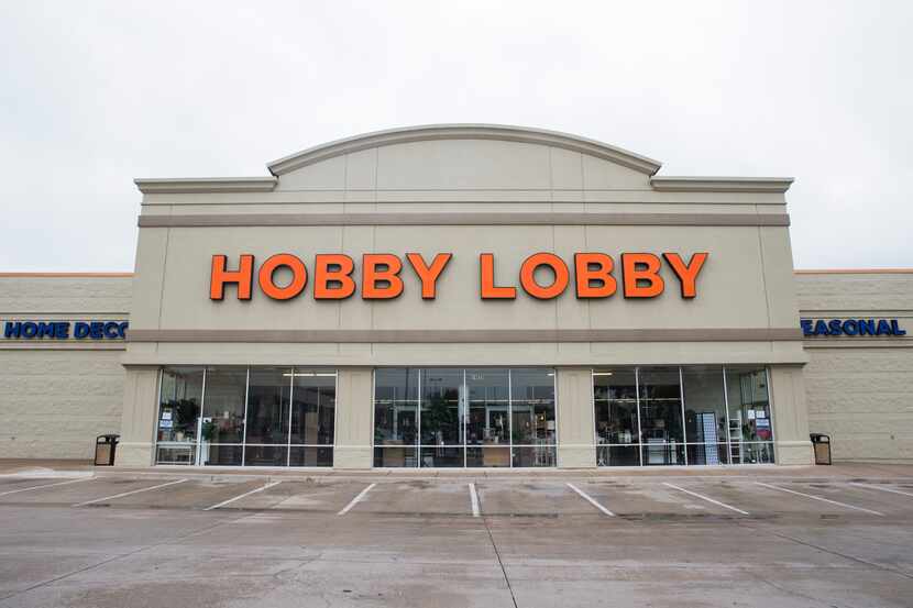 Signs were posted at the front entrance of Hobby Lobby on Friday on Preston Road in Dallas....