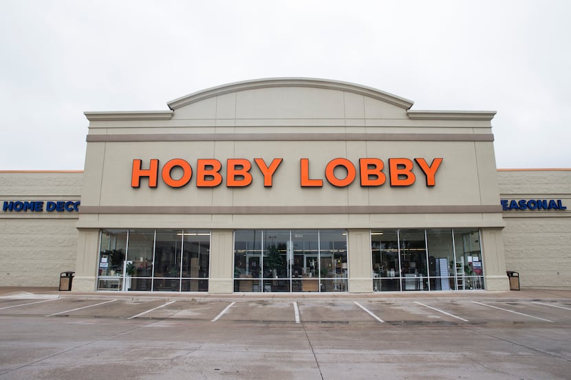 Signs were posted at the front entrance of Hobby Lobby on Friday on Preston Road in Dallas....