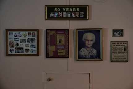 A wall inside the office of Border Missions, which was founded in 1956, displays photos of...