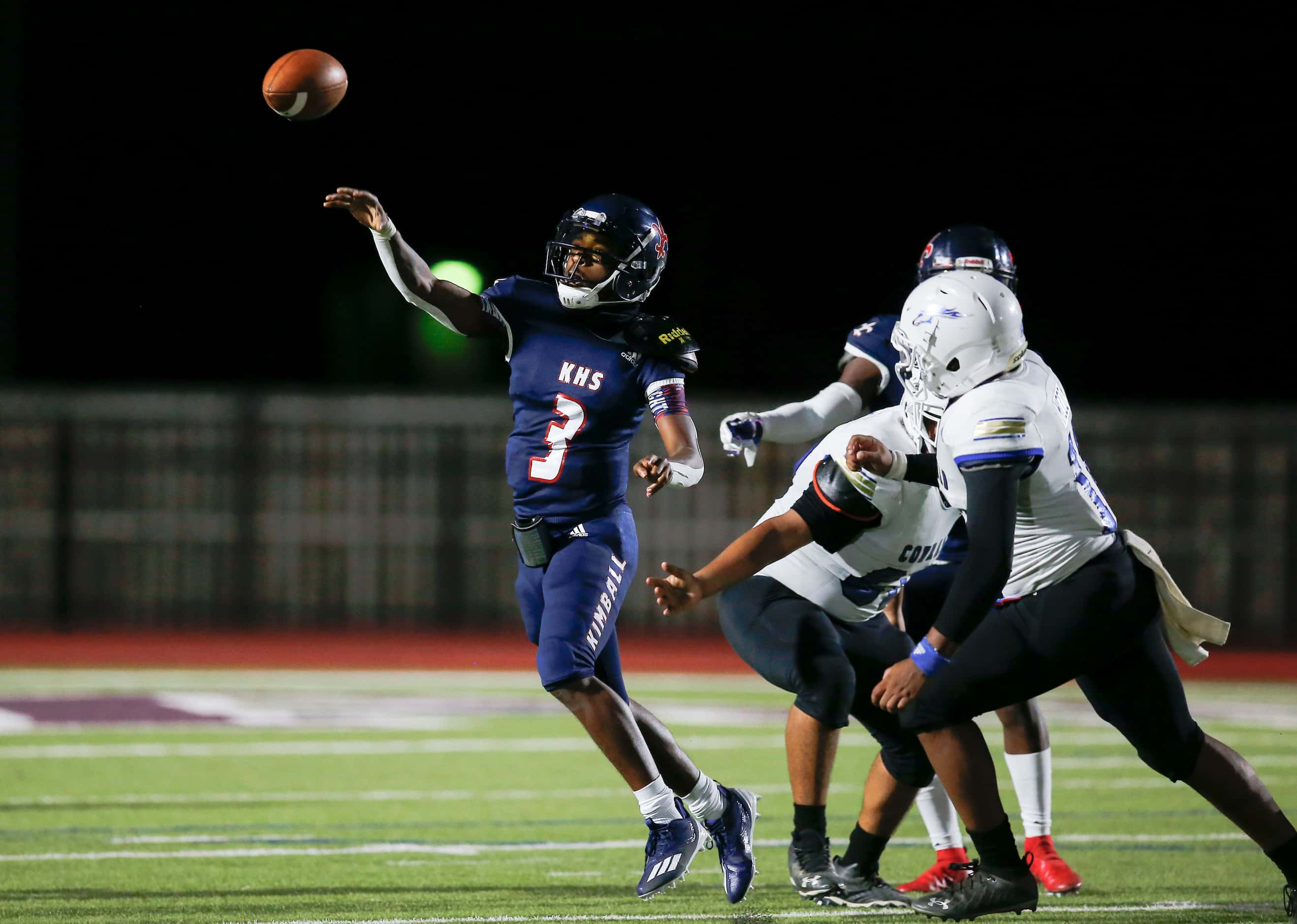 Kimball senior quarterback Jerqualan Parks throws during the first half of a high school...