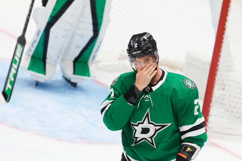 Dallas Stars defenseman Jani Hakanpaa holds his nose after engaging in a fight with...
