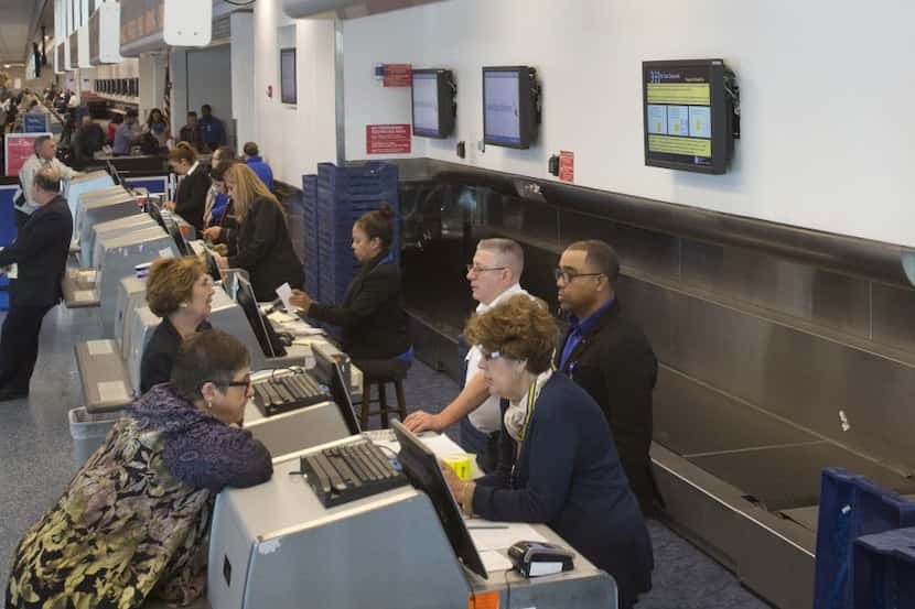  Travelers in Miami earlier this year checked in for American Airlines' charter flight to...